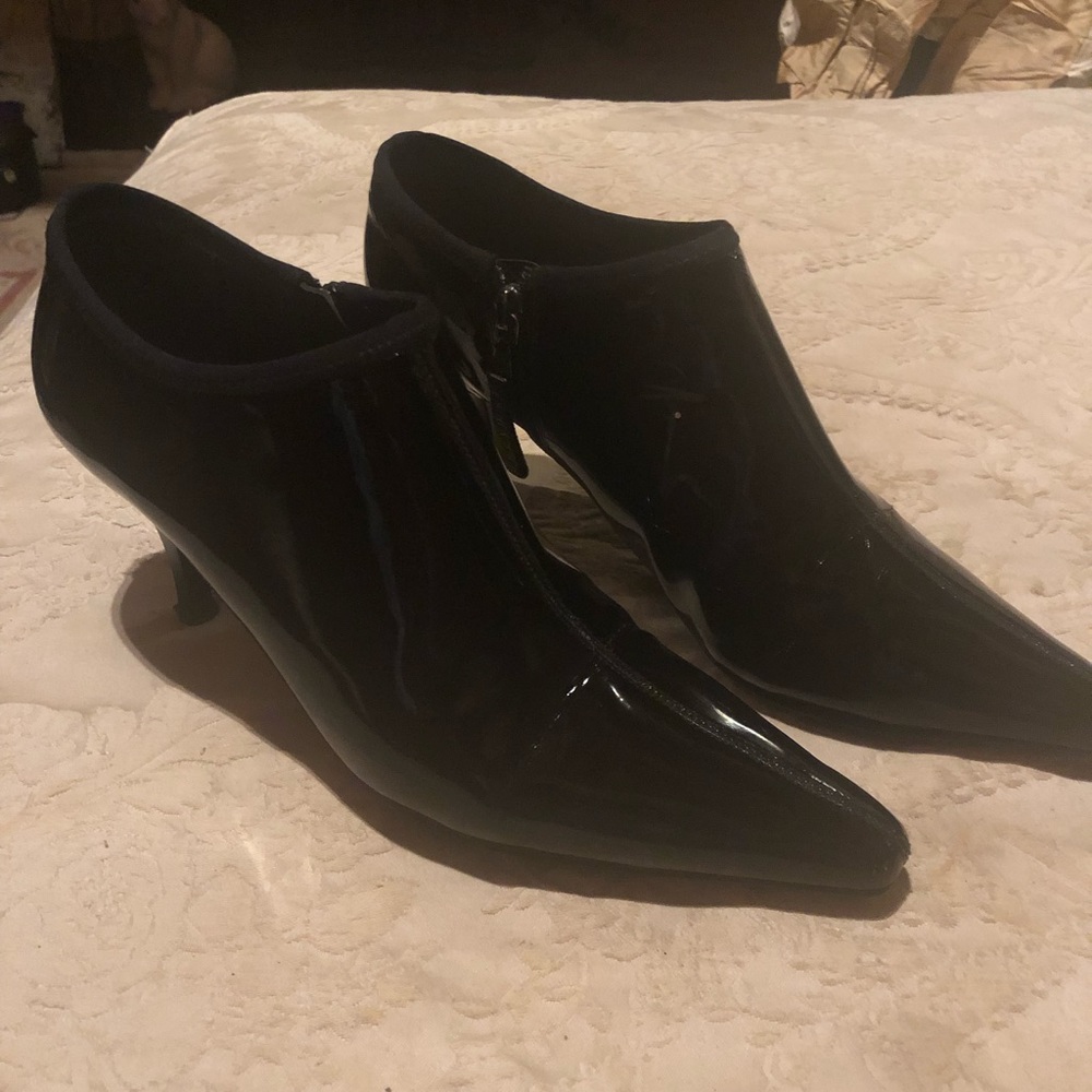 Prada black patent leather boots. Heals repaired.